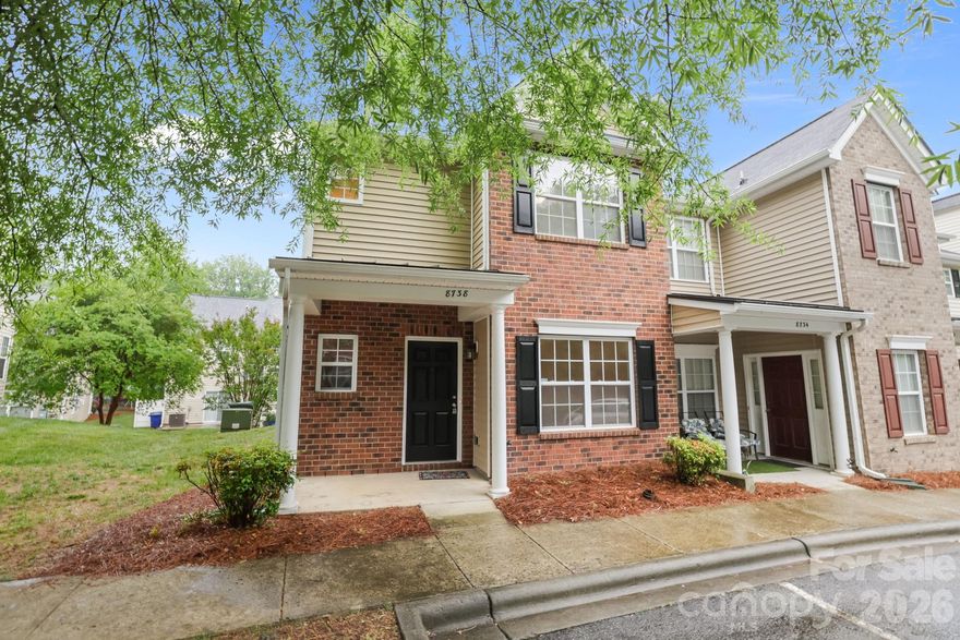 Welcome Home! End unit townhome with quaint front porch and stylish blend of brick and vinyl exterior. The main level has all new luxury vinyl plank flooring and an open concept kitchen and living area centered around a cozy gas log fireplace. The kitchen is fully equipped with brand new stainless steel/black appliances, sleek quartz countertops and a pantry!  In family/living area, double glass doors lead to a patio where you will find a small storage closet. Don't forget the front room which can be a home office, formal dining, workout room, recreation room-make it your favorite room.
Being on the end, tons of natural light flows throughout the home giving you a warm happy smile every morning. Upstairs has brand new carpet. The spacious owners suite has private bath with a soaking/garden tub to relax daily! The other 2 bedrooms are nice sizes and good closet space, laundry is made for a stackable washer and dryer.
Enjoy the convenience of 2 assigned parking spaces in front of the townhome. Location is easy access to Mint Hill and Charlotte, just minutes to multiple Parks and Reedy Creek Nature Preserve! Looking forward to your viewing.