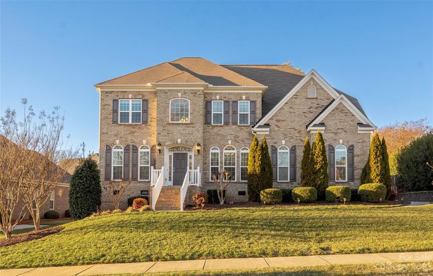 Experience luxury living in this immaculate 5 bedroom, 3 bath home situated in Laurel Park. The open floor plan offers formal living and dining room, leading to a grand two-story great room illuminated with natural light and cozy fireplace. The gourmet kitchen offers granite countertops, double ovens, gas cooktop with a spacious island the home chef will love. Hardwood floors grace the main level and upstairs landing. Guest suite on main w/ full bath. Second level offers spacious owner suite w/ dual closets with custom shelving, luxurious bath w/separate shower and soaking tub. Don't miss the large storage room off the primary bedroom closet. 3 additional bedrooms and an oversize laundry room contribute to the functionality of the home. Step outside to a breathtaking 1600 sf patio with 2 large pergolas and a built-in fire pit. A dream come true for outdoor enthusiasts. Community amenities include clubhouse, 2 pools, tennis courts, and more. Easy access to shopping and I-85.