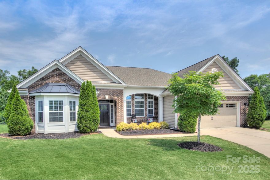 Stunning open-plan ranch nestled at the end of a quiet cul-de-sac Home features a spacious layout perfect for modern living & entertaining. Inside, you'll find a well-appointed kit that’s a chef’s dream (gas cooktop, dbl wall oven & ample counter space). A tiled backsplash, granite & under-cabinet lighting—finishing touches that enhance both style and functionality. Large PBR features a separate sitting area, ideal for a home office/second walk-in closet. Luxurious en-suite bath offers a tiled shower with built-in bench, garden tub, dual vanity & a walk-in closet with custom cabinetry. Highly rated schools, access to I77 & shopping/dining. Enjoy seamless indoor-outdoor living w/ a screened porch that extends entertaining space. Step out to the patio to gather around a roaring fire. Community offers top notch amenities. A trail directly behind the home connects to Baxter. This home combines comfort, privacy, and top-tier community living—don’t miss this rare opportunity! Ref, W&D convey