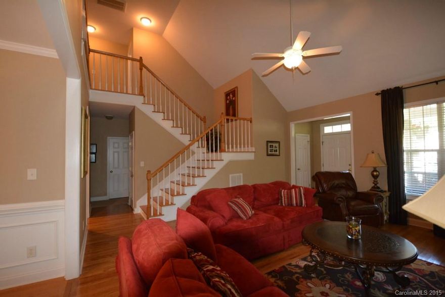 Beautifully maintained 4 bedroom, 2.5 baths, hardwood floors throughout downstairs living areas; new carpet!  High vaulted ceiling in great room and master bedroom (which is on the first floor).  All kitchen appliances remain.  Granite countertops.  Master bath with 2 closets, double sink vanity, whirlpool tub and separate shower.  So much to offer!