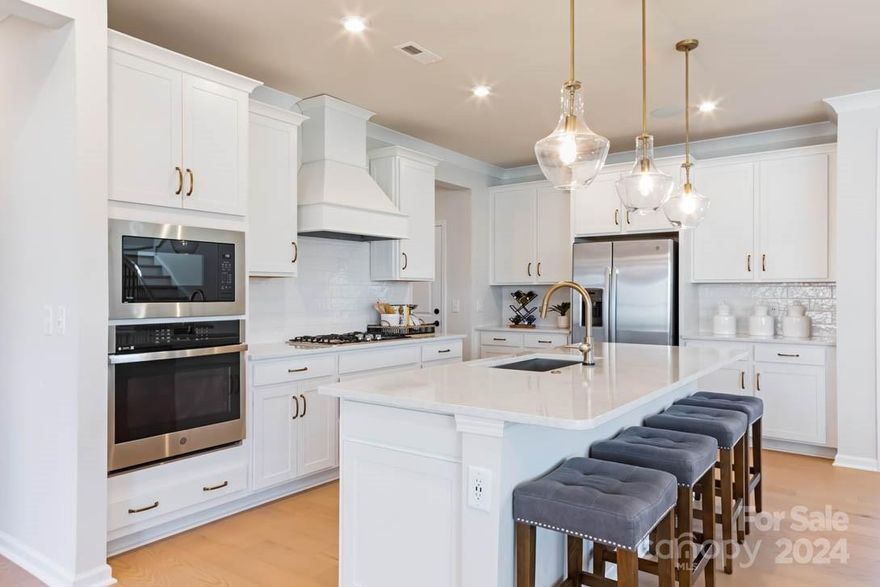 Uncover a whole new world of luxury living, in this astonishing new home at Eckley. Boasting almost 3,200 sqft of open concept living space with 5 bright bedrooms, this is not a deal you want to miss. The gleaming white gourmet kitchen features a gas cooktop, high-end soft-close cabinets, added glass doors, under cabinet lighting, and a white cast iron farmhouse sink. The incredible gas fireplace has matching white cabinets with a huge 12' sliding glass door connecting to the covered outdoor living space out back. This home is nearly completed, schedule a tour now to get an inside look before it's gone!

- Upgraded Primary w/ Tray Ceiling and Oversized Tile Shower
- Added Office w/ French Doors + Full Bedroom/Bathroom Downstairs w/ Tile Shower
- Hardwood Flooring and Staircase w/ Open Stringer + Upgraded Baseboards