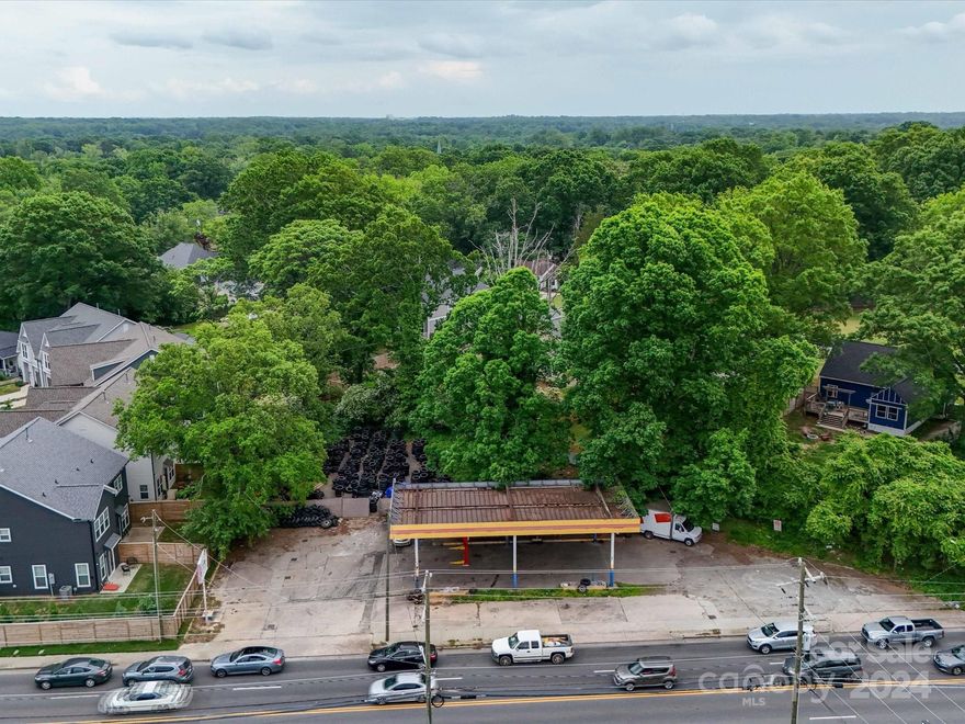 Plaza Midwood is known for its eclectic vibe, historic homes, and a vibrant mix of shops, restaurants, and entertainment venues. The area combines a rich history with a modern, trendy atmosphere, making it a popular destination for both residents and visitors. Formally a gas station this .44 acre property functions as a leased operating tire store on a month to month lease. With the fuel tanks removed this location offers endless possibilities zoned as General Commercial.