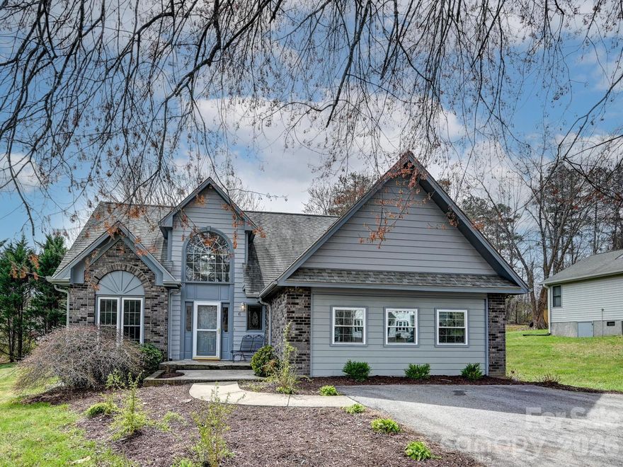 Welcome to Meadow Oaks, a wonderful neighborhood located in the heart of Fletcher. This 3 bedroom 2.5 bath home is conveniently located 13 minutes from downtown Hendersonville, 11 minutes from the Asheville Regional Airport and 25 minutes to downtown Asheville.  Enjoy the freedom of no HOA, allowing you to enjoy your home without added costs.  The main level has a welcoming functioning layout with a formal dining area, kitchen/family room, half bath, an enclosed heated porch and a large master bedroom, with a bonus area which can be used as a nursery, office or bedroom. The laundry is conveniently located on the main floor. Guests can feel like they have their own space with 2 separate bedrooms and bathroom on the 2nd floor. This home was recently updated with new flooring upstairs and freshly painted rooms and trim throughout the home. The detached shed (10 X 20)  is perfect for lawn equipment, extra storage and trash cans. In May 2022, the lots were straightened, see Plat Book 2022 Page 14445. Community Well shared by 5 homes.  Well is located at the top of the street. The septic system is for 3 bedrooms which is why one of the bedrooms is listed as bonus space. Sellers had a sump pump drain system installed in the crawlspace when they purchased the home.  The crawlspace and home has had no water issues since purchase. No water after Helene.  Appliances were new in 2022. Check out our virtual tour and schedule a showing to see this wonderful family home close to shopping, restaurants and all the Fletcher and the South Asheville area has to offer.  This home is districted for Fletcher Elementary School, Apple Valley Middle School and North Henderson High School and is located very close to FernLeaf Charter School.