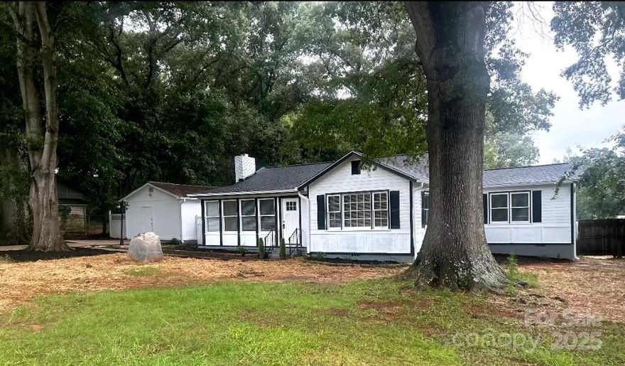 Country living at its finest in this updated 3 bed, 2 bath 1,543 sqft home in Rock Hill. Outside the home you will see plenty of mature trees, making the yard comfortable and shady. Walking inside, you are greeted with a huge open concept living room complete with an elegant chandelier and a fireplace to keep you cozy on the cold nights. The kitchen has tons of cabinet space, granite counter tops, and matching stainless steel appliances, with a separate dining area. The bedrooms are bright and spacious, with the primary bedroom featuring a private bathroom. In the backyard you have a sprawling covered deck, perfect for outdoor entertaining, and .42 of an acre, with 4 storage areas. Interior of home updated in 2025 including new LVP Flooring, septic replaced in 2025. About a mile from the home will soon be a 1,900 acre park/ forest preserve along the river, and I-77 is just a short drive away with shopping and restaurants close by. Don't miss your opportunity to own this beautiful home!