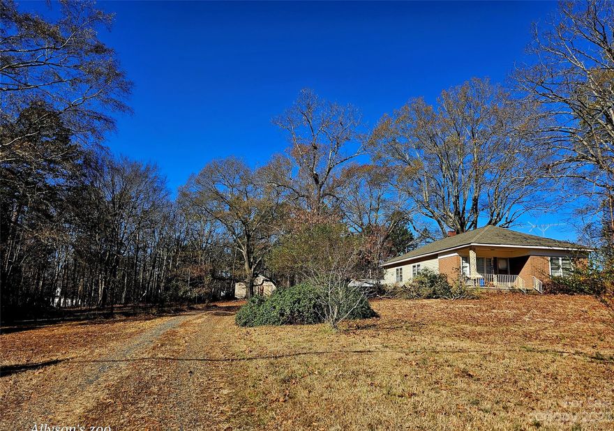 ***All offers welcome!!!***. This bungalow 1-story home has great bones and is sitting on a nice big 1.5 acre lot with a big workshop barn out back, a fenced in area, 1 car carport. Bring your dogs, your chickens, your RV and boat, there’s room for everyone! The house has high ceilings, new plumbing under the house, an annually maintained hvac system, new shower in the main bath, pine hardwoods in the dining room, gas stove in the large, open kitchen. Utility room/laundry/separate office space are unseated. Has city water/septic here (no septic records available). Also has blown in insulation. HWH is about 7 years old. The location is where it’s at with this home, near restaurants, Badin Lake, Lowe’s, shopping, schools. It’s also convenient to the Concord/Harrisburg area as well as Huntersville. **Sellers are packing so it’s quite messy right now hence lack of photos. See recent survey - This house on tract 2 is included in this listing only.