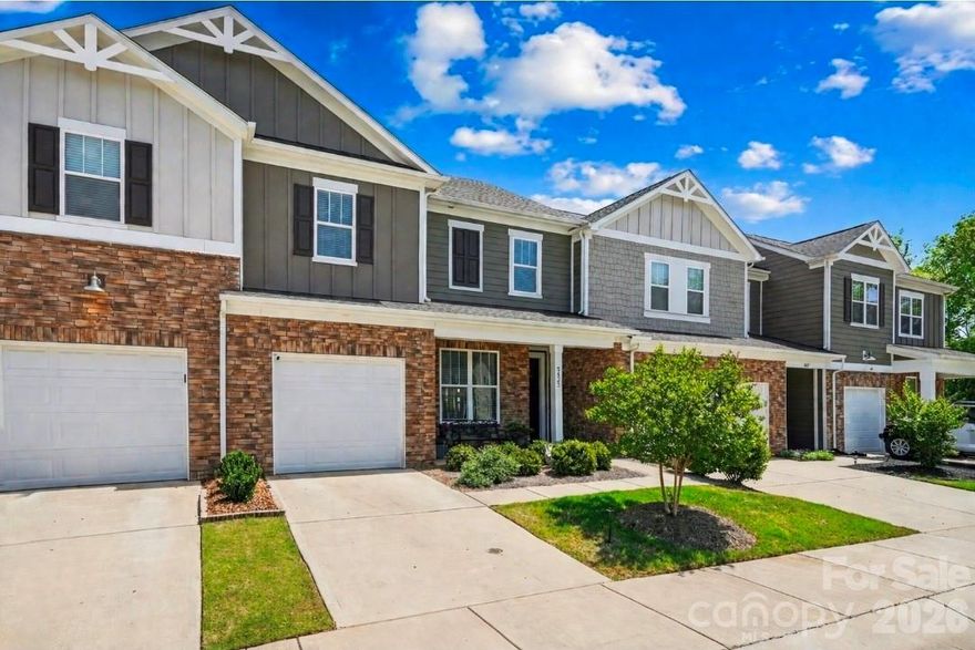 Lake Wylie lifestyle meets high-end upgrades...This beautifully designed townhome offers rare privacy, a custom wine cellar, and resort-style amenities just minutes from everything. 

This open-concept floor plan flows effortlessly, featuring a designer kitchen with top-tier appliances (including built-in air fryer oven), granite countertops, sleek EVP flooring throughout the main level, and a BEAUTIFUL custom wine wall + cellar that creates a true showpiece for entertaining. A main-level bedroom with closet, currently styled as a private gym, offers flexibility to fit your lifestyle.

Step outside to your own curated retreat, a professionally designed, fenced backyard with patio, white stone accents, rose garden, mature trees and multiple seating areas. Enjoy rare privacy with no units directly in front or behind, plus ample guest parking just steps away. Enhanced sound insulation and a WHOLE-HOME Kinetico
water filtration and softener system, extending to all plumbing and outdoor irrigation... elevate everyday living!

Located in The Vineyards on Lake Wylie, residents enjoy resort-style amenities including lake access (boat/kayak dock/launch), two pools, clubhouse, fitness center, boat/RV storage, and scenic walking trails, all just minutes to the River District, Belmont, airport, Uptown, and SouthPark. 

Thoughtfully priced to sell, highly upgraded, and positioned for today's market. This is a rare opportunity in a sought-after lake community!
