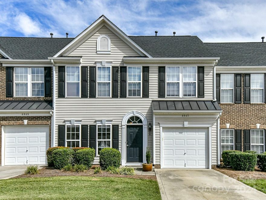 Fabulous 3 BR /2.5 bath townhome w/1 CAR GARAGE in Indian Trail backs up to private common area. Convenient to shopping, restaurants & theater you will simply love living in Holly Park with a community pond at the center of the community. This amazing home has just been painted a beautiful neutral color and is move-in ready. The open floor plan features a fantastic SUNROOM overlooking fenced backyard. Large family room perfect for entertaining, connects to Breakfast area & kitchen w/additional bar seating & food pantry. Formal Dining Room off of the main foyer area. Spacious primary suite has TWO WALK-IN CLOSETS w/shelf systems, trey ceiling, garden tub & separate shower. Roomy secondary bedrooms are sure to please! Step out onto the patio to relax and enjoy the private backyard with small pond underneath trellis. Refrigerator, washer & dryer are included.  HOA dues include water/sewer & lawn outside of fence. Water Heater replaced 2024. Furnace replaced 2021. $7000 Flooring Allowance