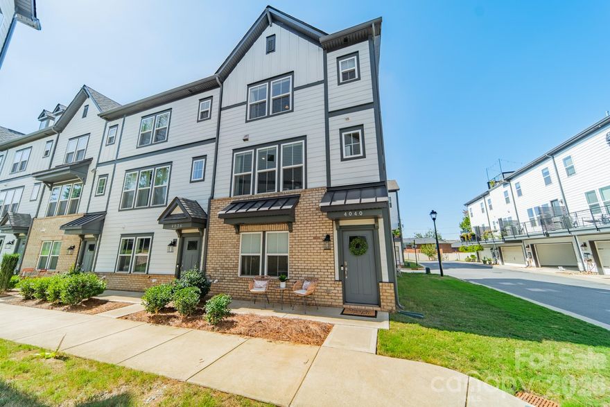 OPEN HOUSE 2/28, 1-3PM. Sleek, sophisticated, and flooded with light, this better-than-new four-story townhome sits just minutes from Charlotte’s best dining, shopping, and nightlife! 

The entry level features a two-car garage with EV charger and a private guest suite with a full bath. The main living level stuns with an open-concept layout, gourmet kitchen with oversized island, fireplace, and deck made for entertaining. Upstairs, find three bedrooms, including a serene owner’s suite with a walk-in closet and a dedicated laundry room. 

The showstopper—a rooftop sky terrace for outdoor dining, morning coffee, or evening relaxation—complete with a bonus storage room that takes this home from impressive to unforgettable!