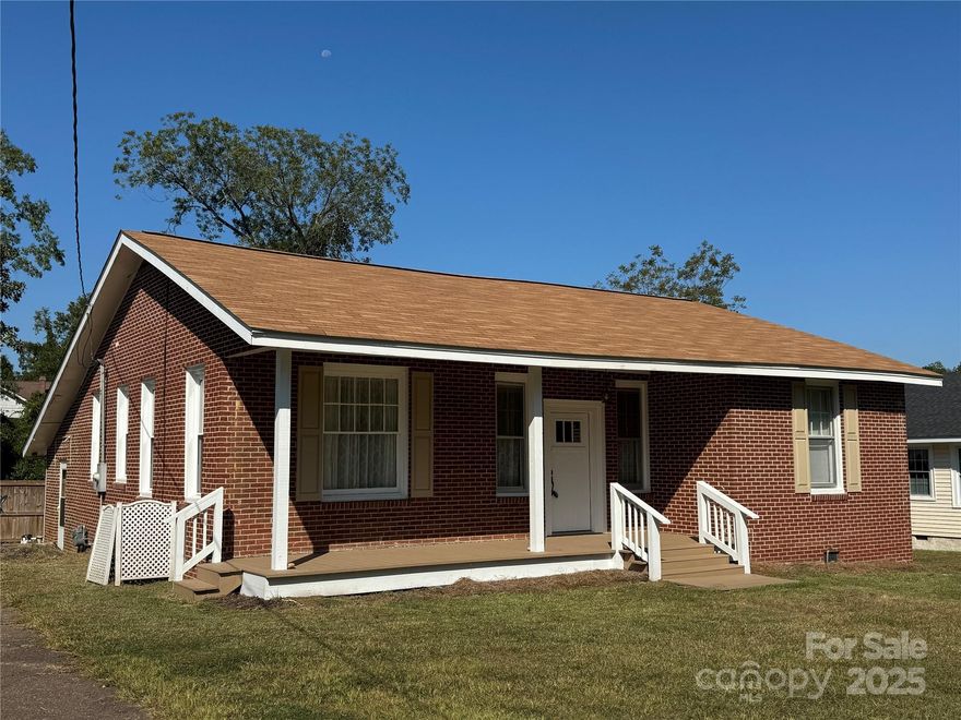 Don't build a pool. Let's buy a home with a pool!! Bring your bathing suit and suntan lotion! Enjoy the convenience of walking distance to downtown Edgefield with shopping and great restaurants and NO City Taxes. This lovely vintage home with soaring ceilings, hardwood floors and country kitchen is waiting for a new owner. Kitchen has granite countertops and refrigerator is included. Fireplace in Main Foyer welcomes you to this charming home that features new windows. Primary bedroom and new handicap access shower/bath is at rear of home. This area has an extra rooms with another fireplace that could serve as an in-law suite with additional entrance. Rocking chair front porch! Corner fireplaces (all fireplaces are decorative) are cozy archetectural features in the second and third bedrooms. Roof is 2 years YOUNG! All the heavy lifting has been done here so bring your suitcase, unpack and enjoy the pool side living. Lot is extra large and has access from side street. Plenty of room for gardening! This area qualifies for USDA financing.