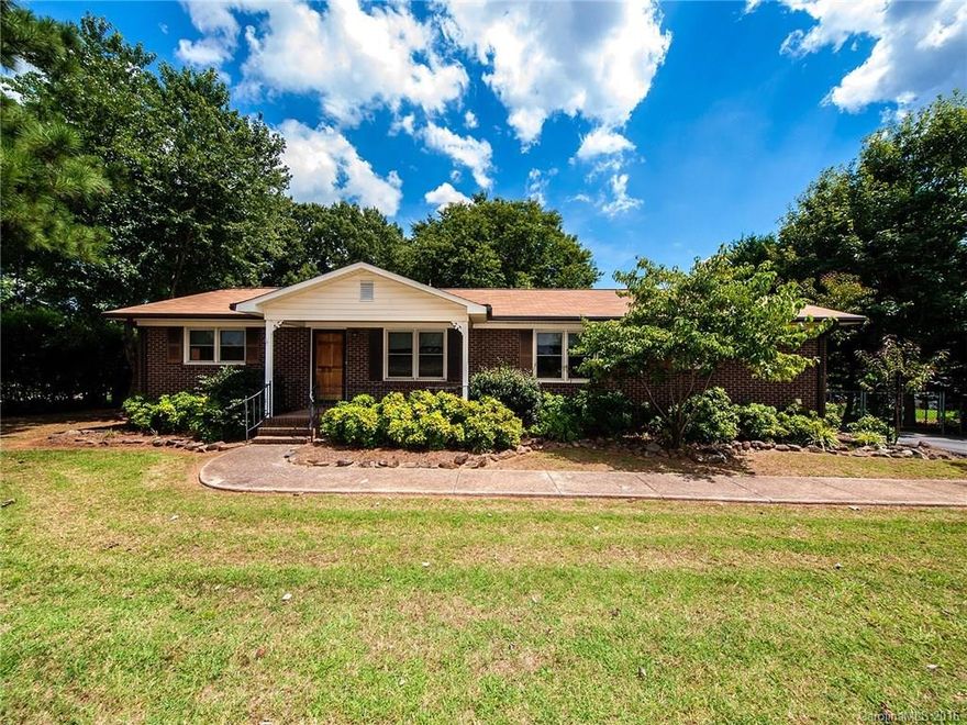 Ranch style home on level lot with detached garage along with an attached carport.  The yard is beautiful and reaady for your family!  This home has 3 bedroom and 2 full bath rooms.  The appliances remain.  The laminate was recently installed.  This house is spic and span and move in ready.  It is on a large .65 acre lot.  You will love the built ins on each side of the fireplace in the family room.  Sunset views from your front porch swing.  This home will go fast!  Schedule your viewing now!