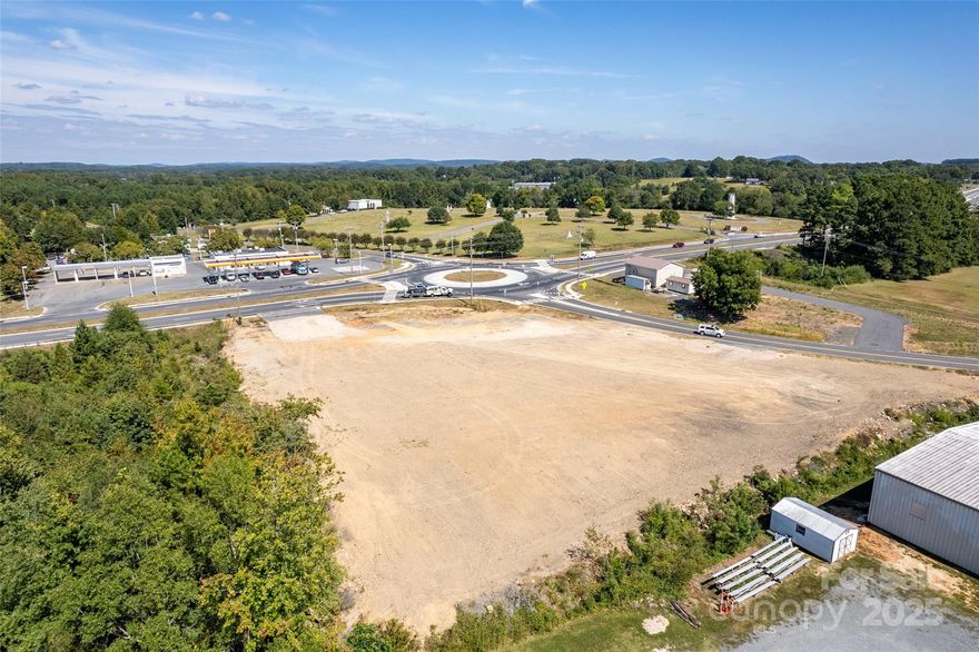 Prime development opportunity in the heart of Albemarle’s growth corridor. This ±1.85-acre cleared and leveled site offers ±496 feet of frontage on E Main Street (NC Hwy 24/27) with dual access points from intersecting streets. Zoned General Highway Business District (GHBD) and located within an Opportunity Zone development. Key Features: ±1.85 acres, development-ready ±496 ft of E Main Street frontage General Highway Business District zoning (GHBD) Located in federally designated Opportunity Zone Traffic count: ±15,500 vehicles per day on E Main St Public water and sewer available Adjacent to Albemarle Business Center & NC Hwy 24/27 corridor Surrounding growth: residential subdivisions, industrial park, and retail services Market Highlights: Albemarle, NC, boasts a stable population of 28,500 with a strong “Salt of the Earth” demographic—85% homeownership, average household income of $80,000, and low 4% unemployment . The area’s family-oriented community and increasing home values (+1.9% YoY) create strong consumer demand for new retail and service options.  Statistics: Copyright 2025 Realtors Property Resource®