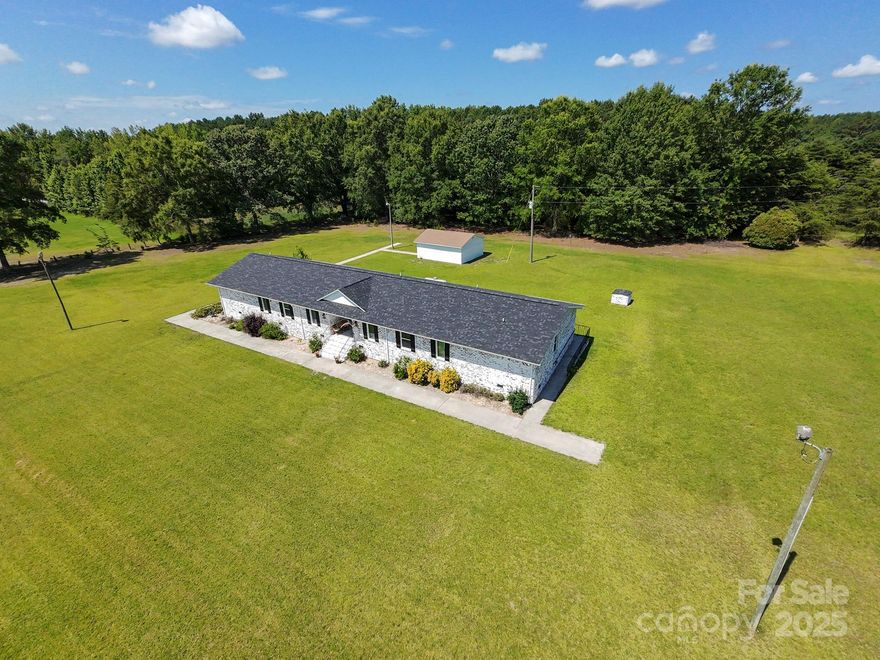 NEWLY RENOVATED RANCH STYLE HOME! This spacious home sits on approximately 2.6 acres. An open living, kitchen and dining area is generously sized for multiple seating and dining areas. A large pantry off the kitchen has plenty of storage and room for additional refrigerator/freezer and shelving. The flex room off the living area would be ideal for an office.  The primary bedroom has space for a king bed and seating area and the primary bathroom and closet are large and well appointed. A second primary suite has its own bathroom and large closet.  Two additional bedrooms share a large Jack and Jill bathroom with double sinks and water closet. The laundry room has space for appliances and room to expand for additional cabinetry and storage.  Every room in this home is surprisingly well proportioned. The home is situated such that there are spacious front, rear, and side yards. The detached storage building has many potential uses. If you need a large, renovated home, this may be the one.