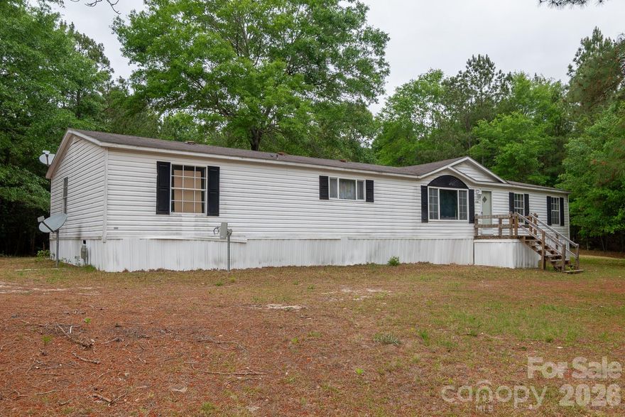Tucked away on a generously sized parcel bursting with mature trees and lush natural growth, this property offers a rare opportunity to own a slice of peaceful, private land. The existing trailer has been well lived in and carries the character of years gone by—ready for your vision, whether that’s a renovation project, a temporary residence, or a starting point for something entirely new.
What truly sets this property apart is the land itself: expansive, green, and full of life. Towering trees provide shade and privacy, while the abundant vegetation creates a serene, almost park-like setting. There’s ample space for gardening, recreation, or future development, all surrounded by the calming presence of nature.
Whether you’re looking to invest, build, or simply escape to a quieter environment, this property offers endless potential in a beautiful, naturally rich setting. This property is made up of 2 parcels so the availability to purchase and later sell one parcel if so desired, or perfect for family compound. This home is sold AS IS.