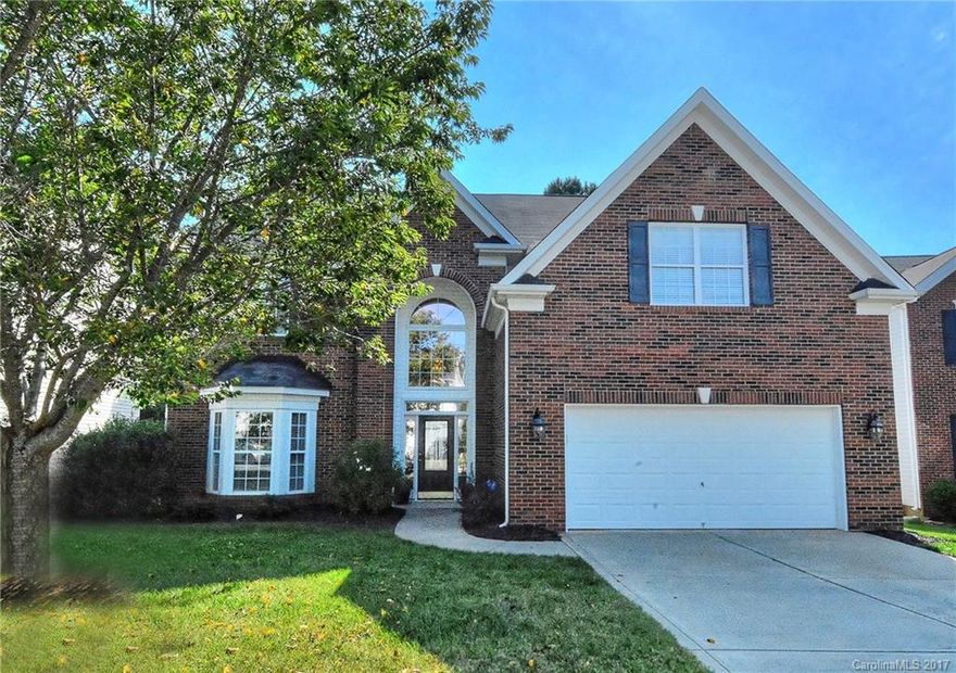 Ballantyne Area-Beautiful Full Brick Front home, sought-after floor plan - guest suite & full bath on main level!  Private back yard is wooded, ext paver patio, full irrig, & fenced! NEW SS APPLIANCES! Spacious kitchen w/ tons of 42" cabinets & huge granite island & breakfast area opens to great room. Carpet & paint 1 year new! 4 very large bedrooms & laundry upstairs. Awesome amenities: pool, club house, sport court, light tennis cts! Near dining, shopping, & ent! Award winning schools.