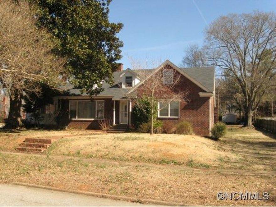 Beautiful older home with lots of charm on a level corner lot.  Feel at home in a great neighborhood yet only 2 minutes from anything you need. Features include 5 BR, 3 Ba with hardwood floors in most of the home, many built ins, and 2 fireplaces. Large screened porch for relaxing or entertaining.  Mud room, detached garage could be workshop. Park just down the street.  If you are looking for charm, look no further. Need space?  Look no further.