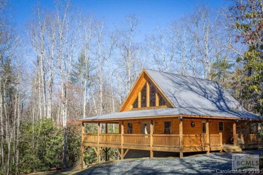 If you want a Mountain getaway, this is it!!! Own it, Rent it for income or just live the Mountain lifestyle. This home is positioned on 2.50 acres and within a half-mile of the Blue Ridge Parkway and the Pisgah National Forest. The Linville River is approximately 1200 feet straight-line distance from the home. Great fishing and hunting opportunities surround this property. Also, you are approximately 15 minutes to the ski lodges and shopping.  Two bedrooms and two and a half baths. Large master bedroom and bath with ceramic tile flooring and custom built tile shower. Hardwood flooring throughout the home. The kitchen has custom built wormy oak cabinets with granite tops.  The basement is unfinished but is plumbed for an additional bathroom. High vaulted ceiling with huge glass windows that face the beautiful Blue Ridge Mountains.  Also, the 824 square foot wrap around porch puts the finishing touch on the home. Act fast