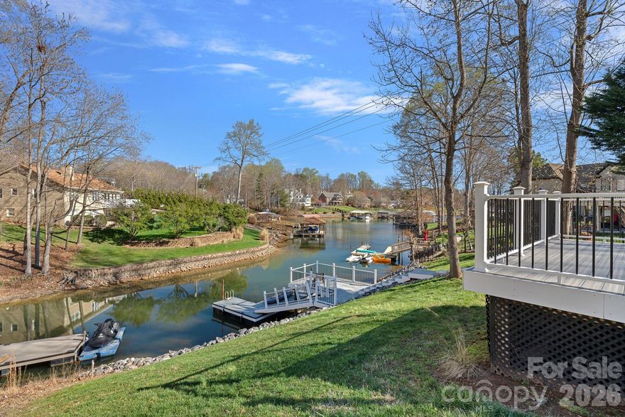 Stunning full-brick waterfront retreat with a private dock and modern upgrades! This 4-bedroom, 3.5-bath home features the primary suite on the main level complete with new hardwood floors, custom cabinetry in both walk-in closets, and a fully renovated bathroom with custom tile work, a soaking tub, heated floors, and designer cabinetry. Upstairs, you'll find three bedrooms, including one ensuite, and a newly remodeled secondary bathroom with a fully tiled shower, new tile flooring, and a new vanity. A versatile bonus room offers flexible space for a gym, office, media room, or playroom. Additional updates include a fully encapsulated crawl space with a dehumidifier, a newly insulated garage door, and custom garage storage. The dock and riprap were replaced in 2024. Enjoy your private waterfront setting along with community amenities including a clubhouse, pool, and boat storage. Thoughtful renovations, functional design, and waterfront access provide the perfect balance of comfort and convenience with easy access to Charlotte. This is one you don’t want to miss!