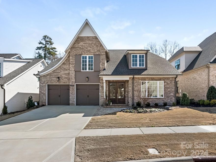 Incredible opportunity in The Enclave at Providence Park! This immaculate home offers a large open floor plan, beautiful hardwood floors, designer kitchen with Wolf appliances and spacious main floor primary suite! Additional bedroom and study/5th bedroom on the main level as well! Two bedrooms with en-suite baths plus bonus room on second floor. Low maintenance back yard features a covered terrace with fireplace and view of the gorgeous pool and spa. Convenient to Strawberry Hill, SouthPark and Uptown!