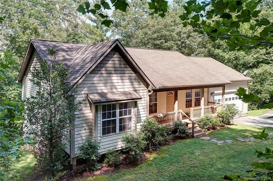 Custom built home with open floor plan and soaring 22 foot timber vaulted ceilings in main living area. Private yet convenient location on Mills Gap Rd. Use your imagination for the unfinished basement. Could be additional rooms, recreation space or separate living quarters with outside entrance. Master bedroom accesses rear deck overlooking one wooded acre. Enjoy the rocking chair front porch and 2 car attached garage. Located in Cane Creek School District and near the community pool.