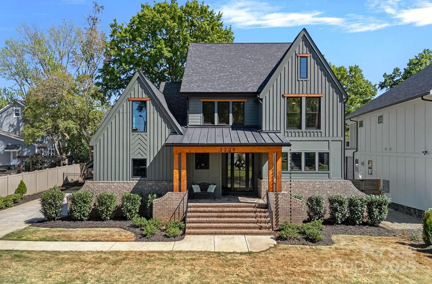 Step away from the ordinary and into this stunning 5BR/4.5BA custom home, ideally situated on a quiet interior street in Charlotte’s highly desirable Sedgefield neighborhood. This beautifully designed home features exceptional craftsmanship, timeless finishes, and a floor plan built for both everyday living and elegant entertaining. Inside, you’ll find soaring ceilings, hardwood flooring, custom moulding and a private main-floor office. The chef’s kitchen is fully equipped with a 48” professional range, oversized island, quartz countertops, floor-to-ceiling cabinetry, and a walk-in scullery. The main-level primary suite includes vaulted ceilings, a spa-like bath with heated tile floors, dual vanities, a stand-alone soaking tub, and a walk-in closet with custom shelving. Outdoors, enjoy a larger-than-average back yard oasis, complete with Bermuda sod grass, full irrigation, professional landscaping and a private sauna — all just minutes from South End, SouthPark, Dilworth, and Uptown.