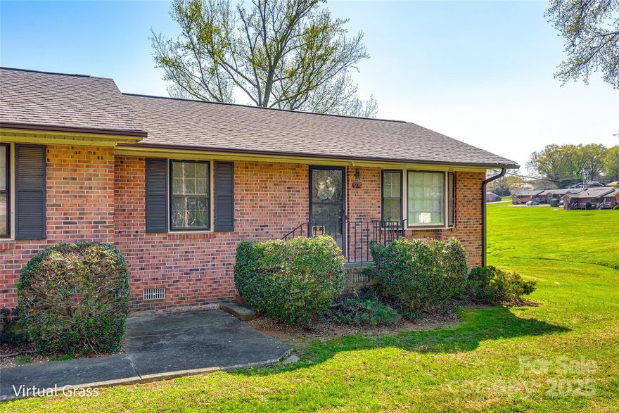 This condo is perfectly located convenient to downtown Rock Hill and plenty of shopping and dining options.  You'll appreciate the updated LVP flooring in the spacious living room and kitchen.  This home offers two bedrooms and a large shared bathroom.  The back deck provides plenty of space for outdoor entertainment, and there is plenty of green space to enjoy around the home.  A great primary residence or potential for an investment property!