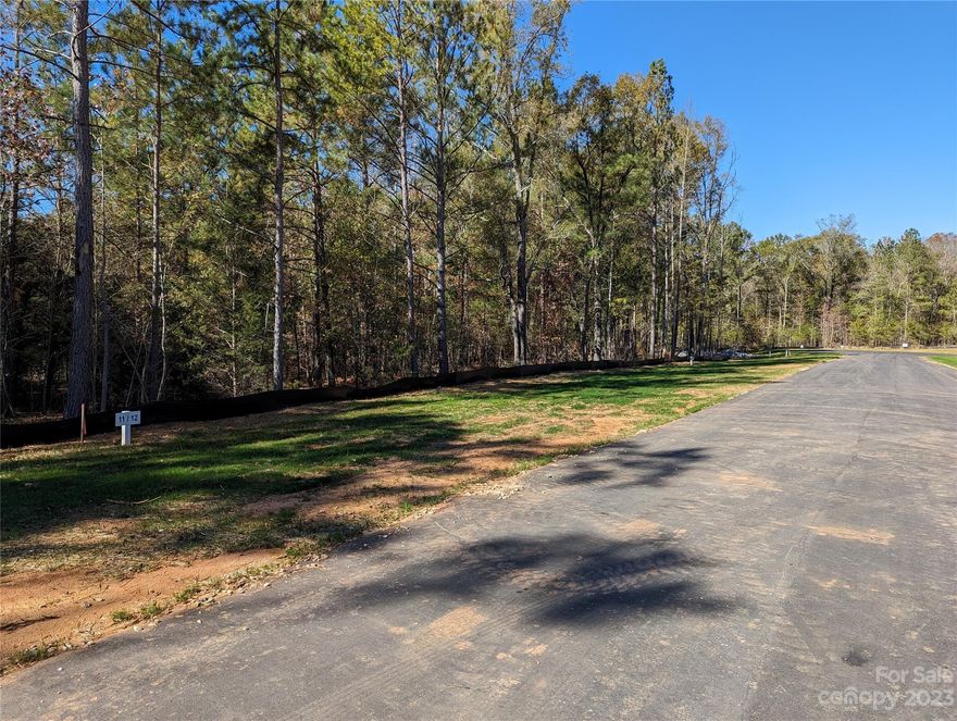Beautifully wooded lot located in the new neighborhood, Heartland Acres. Over one acre of land. Well and septic tank needed. 4 bedroom septic tank permit included. Come check out this residential lot today to build your future dream home on!