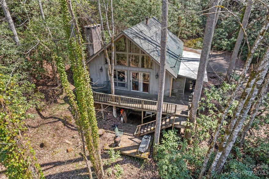If you're looking for that treehouse feel in the mountains with a bold creek, look no further! 16.33 unrestricted acres (comprised of 3 parcels) and borders USFS on one side. Large windows to bring the outside in, 2 bd/1 ba with large loft area (currently being used as a bedroom), woodburning fireplace as well as a woodstove for those cool mountain nights. New roof and skylights approx 8 years ago. Workshop and storage area in the crawlspace. Enjoy your morning coffee on the deck or take a nap on screened in porch..all of which you can hear the sounds of the bold creek below. Rinehart and Tellico Creeks both run through the property.  Land spans across Rinehart road where there are flat areas for enjoying the creek or possibilities for building tiny homes, camping spots etc. Tellico Trout farm is right down the road, approx 5.5 mi to Wesser Bald & AT, 2 min to Little TN River for fishing. Plenty of privacy with this one, would make a great rental. Easy year round access mostly paved.
