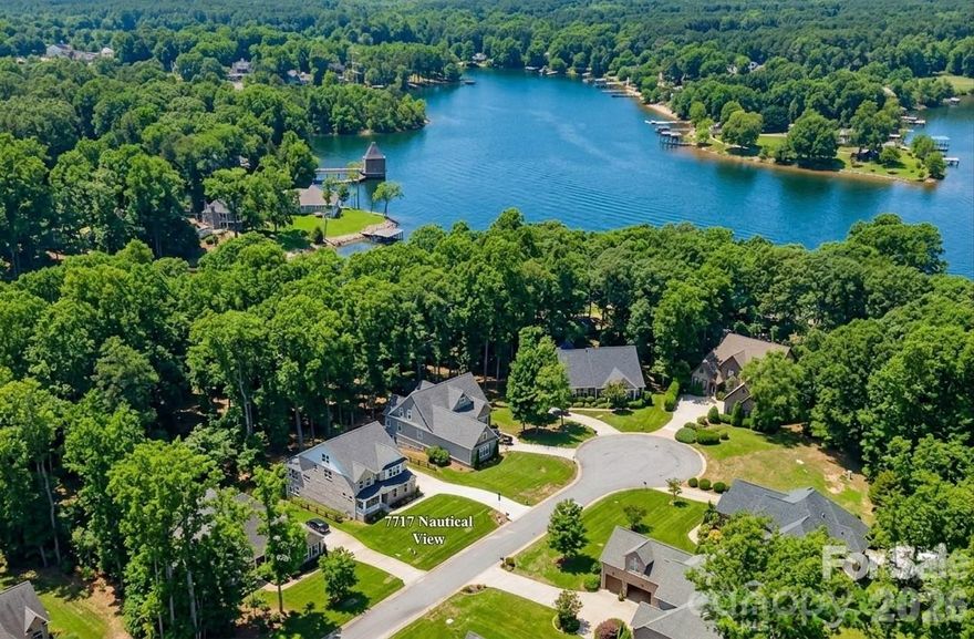 This custom-built luxury home offers over 5,500 square feet of thoughtfully designed living space, featuring a highly desirable primary suite and five additional bedrooms, providing flexibility for families, guests, or multi-generational living.

The grand primary suite is conveniently located on the second level and features a spacious sitting area along with a spa-inspired bath. Upstairs and throughout the home, generously sized secondary bedrooms offer comfort and privacy, while a private third-floor retreat with a full bath creates the perfect guest or bonus space.

Designed for both everyday living and entertaining, the chef’s kitchen is equipped with quartz countertops, a gas cooktop, butler’s pantry, and a mini bar refrigerator. The finished walkout basement expands your living space with a bedroom with full bath, game room and sunroom, opening to a private, wooded backyard with serene lake views.

Situated on city water and sewer, this home combines convenience with peace of mind. The all-brick exterior offers timeless appeal and low-maintenance living, and the home includes a 10/2/1 builder warranty.

Located in Norman Pointe, a walkable community that feels tucked away yet remains convenient to everything Denver has to offer, this home delivers the best of both worlds—privacy and accessibility. Denver is widely considered one of Lake Norman’s hidden gems, offering plenty to do with noticeably less traffic than other Lake Norman towns.

Just minutes from a public boat ramp and a short drive to Charlotte, this location makes commuting easy while still allowing you to enjoy a relaxed, lake-focused lifestyle every day.