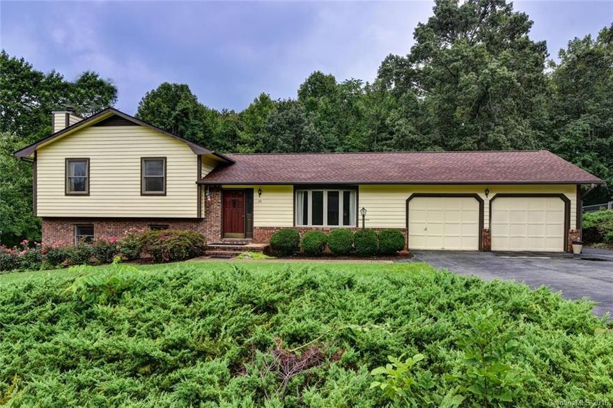 West of Asheville easy living, in this aprox 2000sqft split level Candler home. Featuring 3 bedrooms/2.5 baths with an additional sleeping room and amazing rec/entertainment space in the lowest level that's perfect for escaping the day and relaxing. Enjoy the main level with an updated kitchen featuring granite, skylight, and an open dining area all adjacent to your large private deck overlooking a private green space perfect for children's play dates or dogs that like to run.