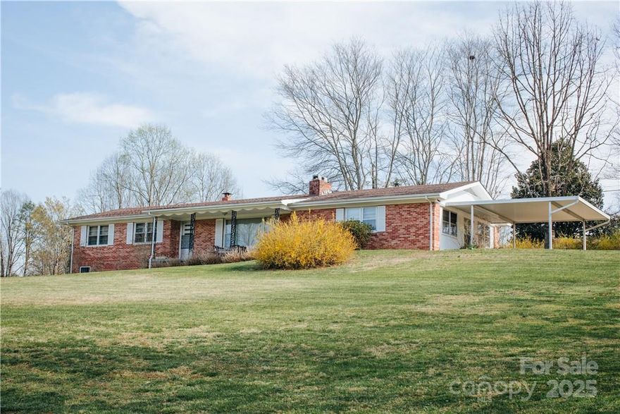 GLENWOOD LOCATION -- ESCAPE TO THE COUNTRY & EXCELLENT VALUE --- It all adds up to an excellent value on this home: great yard on a hilltop knoll on +/- 2 acres, wonderful square footage, & great price. The interior offers a total of 4 large bedrooms, a living room with a brick fireplace, galley style kitchen with dining area, three bedrooms and 2 full baths on the main level including the owner suite with bathroom, a huge den off the carport, and a full basement with interior and exterior access.  The basement offers great possibilities for additional expansion square footage and already has a third bathroom and brick fireplace.  The grounds include several outbuildings and a double carport.  The home is located only a few minutes from I40 Exit 85 in Marion making it a very easy commute to Marion, Black Mountain, or Asheville.