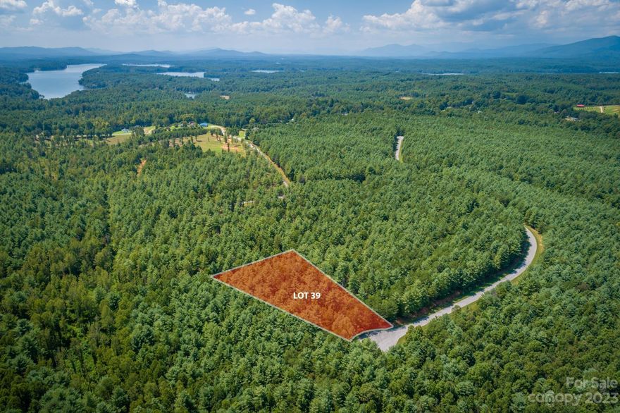 Come see this great wooded homesite in Hawksbill at Lake James, a gated community near beautiful Lake James. Hawksbill offers wooded seclusion and level, easy-to-build lots with gentle paved roads and underground utilities including city water. Only 2 miles from Linville Boat Ramp - an easy & convenient spot to launch your kayak or boat onto Lake James, a 6500 acre lake with over 150 miles of shoreline and incredible views of the Blue Ridge Mountains! Mimosa Landing Marina is only 5 miles away. Only 10 miles from downtown Morganton, a charming small town with great dining, shopping and entertainment, several craft breweries and locally-owned shops. Less than an hour to Asheville and 90 minutes to Charlotte. This homesite offers a great value this close to the lake with the protection of a small gated community.