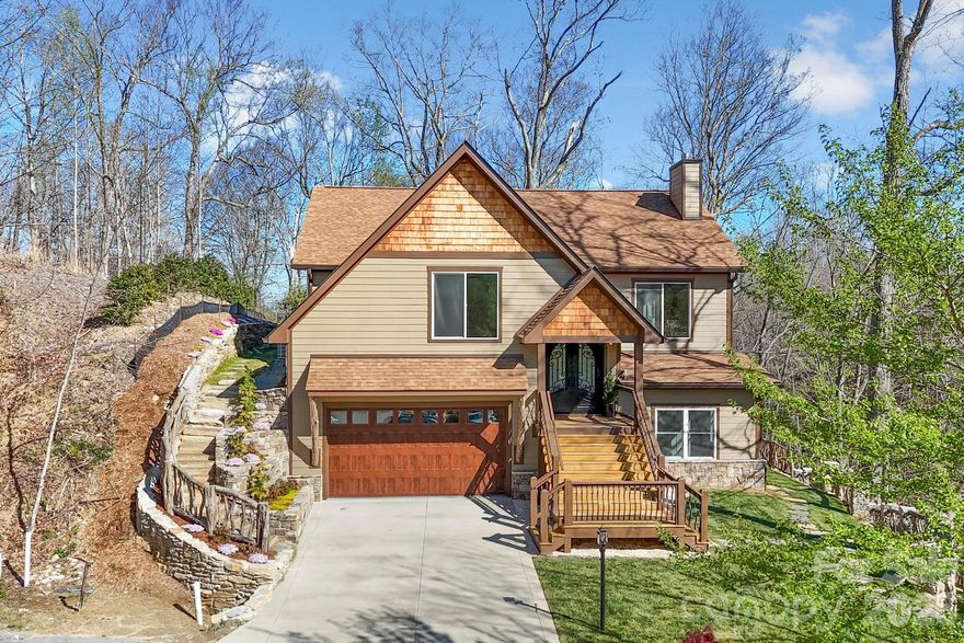 In the gated mountain community of Carriage Park, this newly constructed residence in The Village of the Preserve offers a refined blend of privacy, comfort and elevated design, crafted for those who value everyday ease and exceptional living. From the moment you go inside, the home opens into a seamless living experience, with the great room, dining area and kitchen connecting effortlessly. Expansive sightlines, a gas log fireplace, and architectural flow create a sense of calm and connection, whether hosting guests or enjoying a quiet evening at home. The kitchen is functional and inviting, anchored by a gorgeous island that supports everything from casual mornings to curated gatherings. With five bedrooms, including two primary suites and a home office, this home offers flexibility for multi-generational living or hosting with intention. Each suite is designed as a private retreat, featuring spa-inspired en-suite baths with heated floors and heated toilets, bringing a subtle, daily luxury that quickly becomes essential. Indoor and outdoor living are equally considered. A private balcony just off the dining area offers a peaceful place to start or end the day, while the main-level courtyard, accessed from the family room with wet bar, creates an intimate setting for conversation, relaxation or evening entertaining. Set within The Village of the Preserve, the home is surrounded by the natural beauty that defines Carriage Park. Wildlife sightings, mature trees and mountain serenity are part of the everyday rhythm here, offering a sense of retreat without sacrificing convenience. Carriage Park is a gated, resident-managed community known for its scenic mountain views, private lake, and thoughtfully designed villages. Residents enjoy access to a clubhouse with indoor heated pool, tennis courts, walking paths, and a calendar of social and recreational activities, all contributing to a lifestyle that is active and connected. Just minutes from historic Hendersonville, this home offers proximity to fine dining, healthcare, golf and cultural destinations, including the renowned Biltmore Estate and Flat Rock Playhouse. This is more than a home, it is a place where comfort, design and community come together to create a lifestyle worth stepping into.