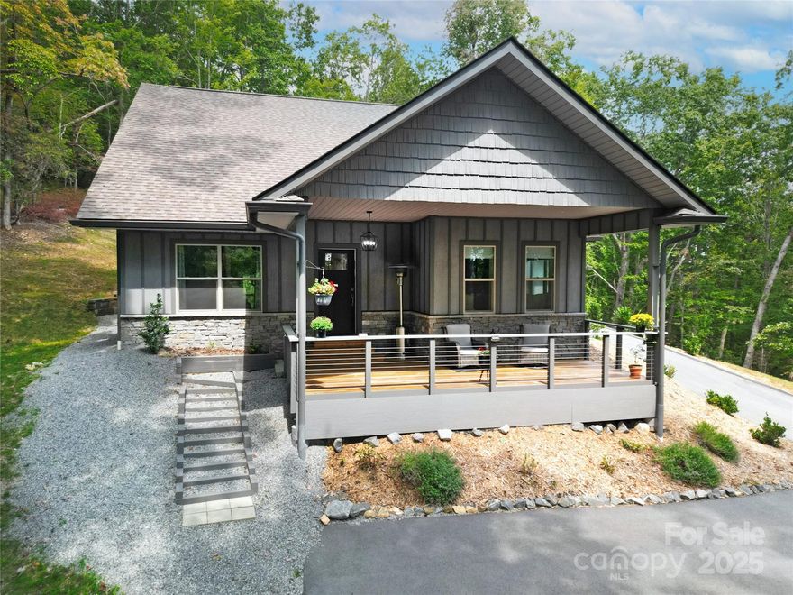 2 year New Modern Mountain Retreat Near Ticoa Lake.  Tucked away on a spacious and private lot, this beautiful 3-bed 2-bath home offers the perfect blend of peace, convenience, and quality construction. Located just minutes from the amenities you’ll enjoy the quiet serenity of nature with seasonal winter views & wooded surroundings. This modern home is energy-efficient, well-insulated, & designed for lasting quality. The open-concept living area is centered around a sleek gas-burning fireplace, perfect for cozy evenings at home. Clean lines, neutral finishes, and natural light through out gives this home a fresh, move-in-ready feel a true clean slate for your personal style.The layout is functional and inviting, with all bedrooms on one level and thoughtful features like a two-car garage for convenience. Whether you’re looking for a full-time residence or a low-maintenance mountain getaway, this property offers the privacy and comfort you’ve been searching for.