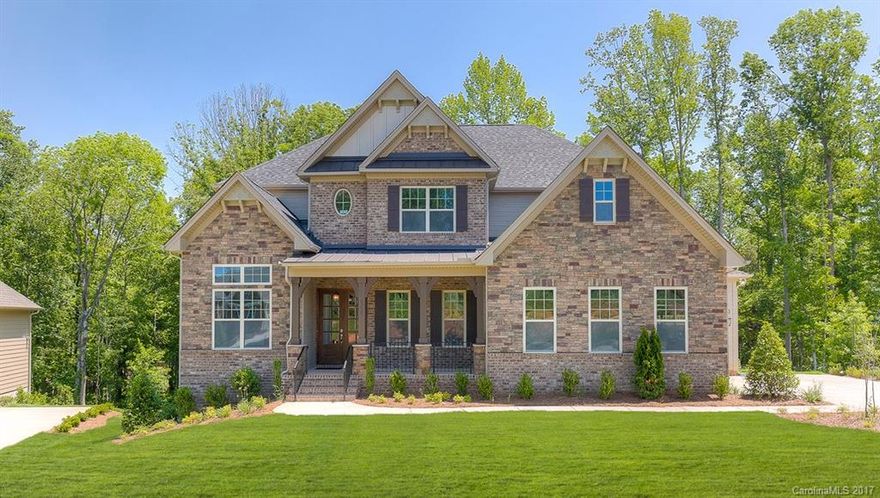 This beautiful estate on over 1 acre water front with exclusive own private boat dock.  Open floor plan with Open gourmet kitchen, large in-law suite down and spacious owner's suite up. Both have nice lake view. finished basement offers extra space for entertainment and over night guest. Customer made cabinets and detail trim through out the entire house.  With elegant master bath and large walk in closets, there are plenty of storage spaces available too.