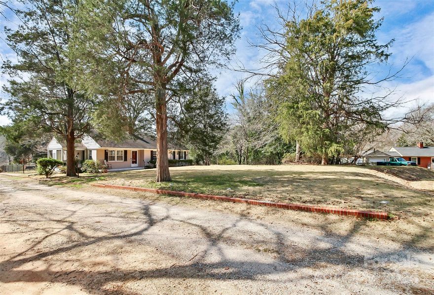 Cozy, private and updates! Come join Lancaster County by nestling into this 3 bedroom, 2 bath home on approx. 2 acres, no HOA and a ton of upgrades. Way too many upgrades to list, please reference documents attached to MLS listing. This home features new paint, flooring, kitchen and bathroom updates and even hosts a detached 2nd livable quarters with kitchenette and full bathroom for your guests or tenants. This residence is reasonably close to I-77 for a getaway to Charlotte/Columbia, or a short drive to downtown Lancaster where you'll find the closest big box stores. Don't forget to sit on the front porch and enjoy the peace and quiet on this low traffic cul-de-sac street.