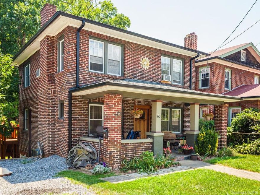 Renovated brick foursquare just off Haywood Rd in Walkable West Asheville. New Sunroom looks out over fenced backyard. Custom Arts & Crafts touches include mahogany entry door and fireplace mantle, handmade cherry kitchen cabinets. Major updates include new Mini split AC / Heating unit on main level, electric service, plumbing, insulated windows, refinished oak floors, new hex tiled bath & soaking tub. Great house and yard!