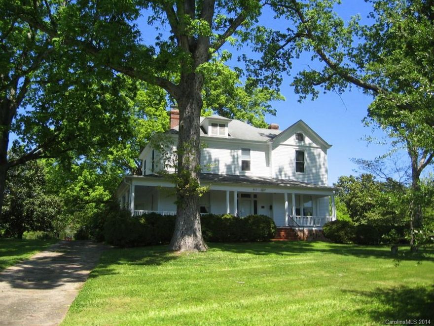 Beautiful older home, mostly original with high ceilings, plaster walls, hugh rooms, wrap-a-round porch, sits on hill top in City of Albemarle,  A lovely  home.  Square footage is living space, old boiler still in cellar with radiators in each room.  System is very old and should be replaced.  Selling house without heat or air for this price.  Call listing agent for more details.