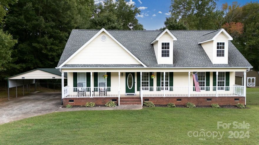 Situated on 2.02 peaceful acres, this charming ranch home offers 3 bedrooms and 2 baths. The thoughtfully designed split bedroom layout ensures added seclusion for the primary suite, which boasts a double tray ceiling, dual sinks, and a walk-in closet. The inviting living room features a vaulted ceiling and a cozy fireplace, creating an open and warm atmosphere. Beautiful wood floors flow throughout the main living areas, while new carpet has been installed in the bedrooms for a fresh, updated feel. Outdoor living is a highlight of this property, with a large, fenced park-like backyard, 2 handy storage sheds, and a spacious screened porch perfect for enjoying the serene surroundings. The expansive front porch offers a welcoming space to relax, and a 2-car detached carport adds convenience. Whether you’re entertaining or simply enjoying the quiet country setting, this home provides a perfect retreat from the hustle and bustle.