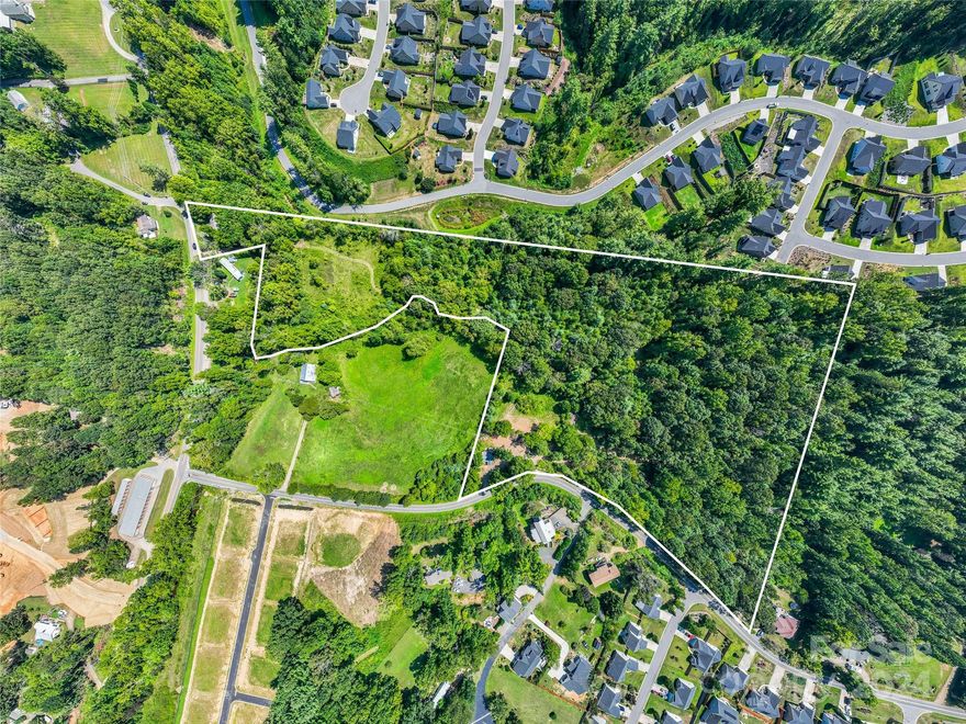 Rolling topography and utility accessibility make this highly accessible site an excellent candidate for residential buildout.  Located in the highly desirable Reems Creek valley, this almost 14-acre land tract is just minutes from downtown Weaverville.  The town continues to show rapid economic and population growth.  Gravity sewer runs through the lower end of the site.  The property is adjoined by both established and approved residential communities. A portion of the property lies within the floodplain. No value has been assigned to the existing structures. Dup. MLS #4178810.
