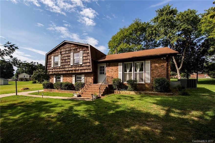 Fully renovated home with tons of upgrades. Main floor features large dining/living area w/ retractable panels & pass-thru window. Super-sized brand new chefs kitchen includes large pantry, 21 new cabinets, gas range with downdraft vent, double oven, TWO SINKS/DISHWASHERS. Upstairs is 3 bedrooms & 2 renovated bathrooms. Lower level includes marble tile, fireplace, walkout 4th bedroom, laundry room & 1/2 bath. 600 square foot deck, garden & outdoor shed complete this conveniently located oasis.