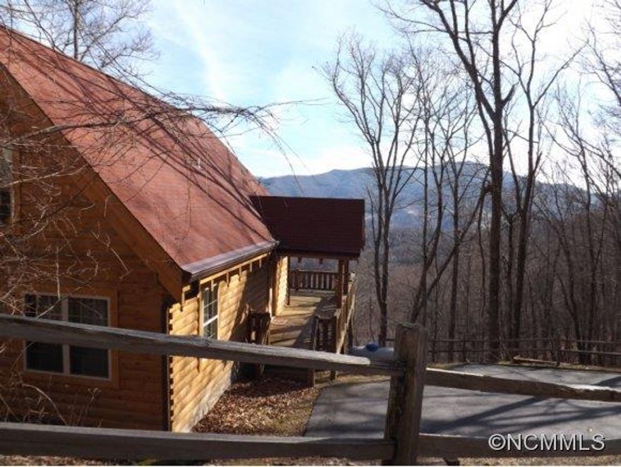 Don't let the days on market keep you from seeing this one! It's hard to schedule appointments. because it rents so well! Cabin has great vacation rental history, if that is your use.  Incredible views and large spacious deck to entertain guests.  Or enjoy the game room with a kitchen/bar area, full bath and bonus room with a closet. Bedroom and bath on each floor!  Large lot for privacy and large parking area.  Come check this one out!
Agents, call about details of $2500 bonus.