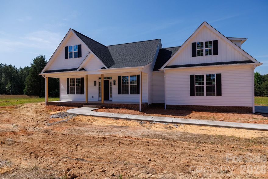 Beautiful 4 Bed/3.5 Bath NEW CONSTRUCTION Home in Edgemoor, SC. Home is on a nice 2+/- acre lot with NO HOA! Primary Bedroom is located on the main level with an en-suite full bathroom for ultimate comfort and privacy. Two Additional Bedrooms are also on the main level. Home features an open floor plan with durable LVP flooring throughout the main living areas. Bonus/Bedroom above the garage includes an en-suite full bathroom. The kitchen features a large central island, Granite countertops, Stainless steel appliances including a modern range hood, and convenient walk-in pantry. Enjoy the spacious living room with vaulted ceiling that opens up to a covered back porch, perfect for indoor-outdoor entertaining. Home is surrounded by like-in-kind properties with large lots. This home provides a quiet area to enjoy outdoor activities and relax. Don't miss the opportunity to own this beautiful NEW CONSTRUCTION home!