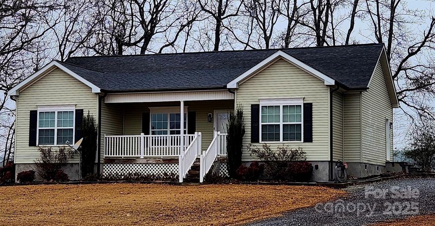 Gorgeous 3 bedroom 2 bath split plan in the Country.  Private, quiet setting with beautiful long range views. Home immaculately maintained with luxury vinyl plank flooring throughout. Wired outbuilding, large yard and patio area. A must see!