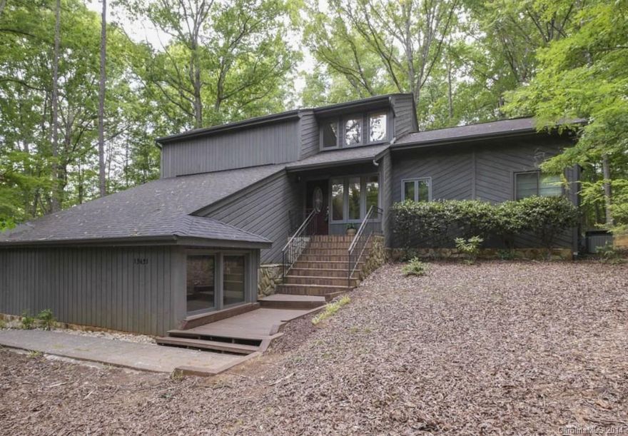 Convenience, privacy & access to Lake Wylie!  Wylie Landing is a tiny community of classic custom-homes on wooded 1+ acre lots.   This home features Sld-Srfc counters & St.St appliances; semi-formal dining, & vaulted GR w/FP.  The Owners-Level has an updated bath w/ soaking tub & connecting den.  A walkout basement houses the spacious Rec Rm, Exercise & Flex Rms, Wine Cellar, & utility garage.  Outdoor buffs will appreciate the low-maint. Deck, Sun Rm, Paver-stone Patio, & designated Boat-Slip.