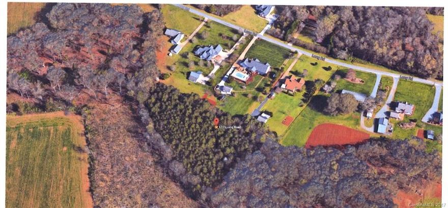 Easy access to 485 and no restrictions on this wooded 2.4 acres lot in Mint Hill!  Private and great location to build your dream home!