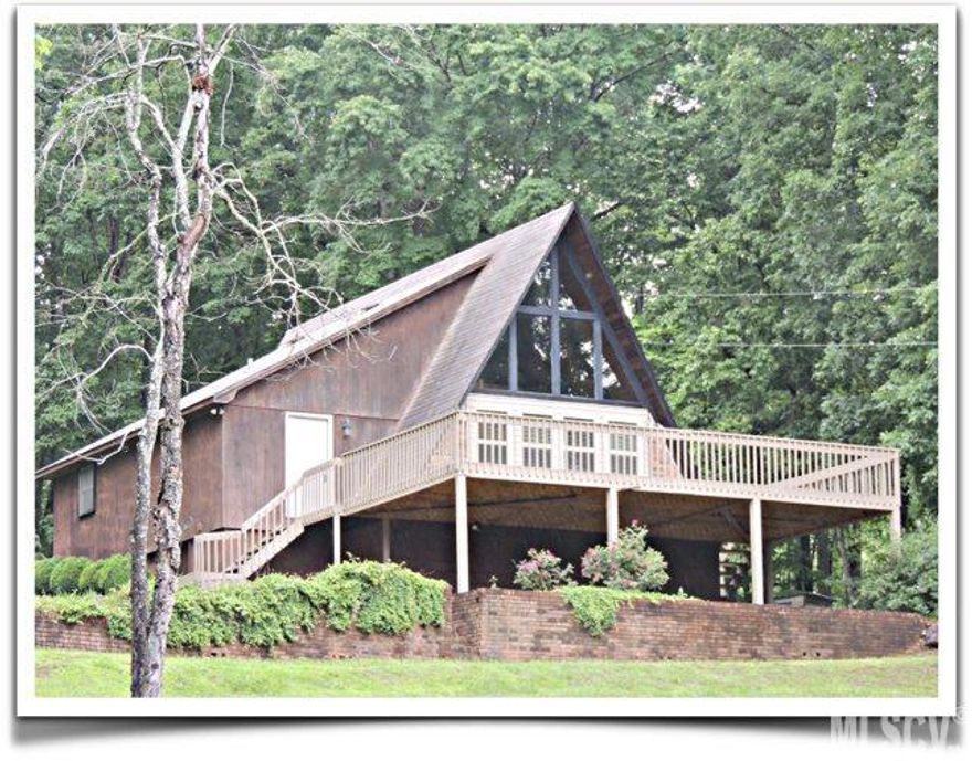 Get away from it all with this awesome a-frame style home on 24+Acres. This home features only 2 bedrooms and 1 bathroom but has a ton of character and room for expansion with a large cleared area, a stream that runs onto the property and lots of woods to explore. The main level features a family room with vaulted ceiling, eat in kitchen, and a large bedroom. Upstairs is a landing and a bedroom with beamed ceiling. Buyers will love the oversized deck that overlooks the open space below and a patio in the back. This property has many possibilities and is priced to sell so schedule a showing today.