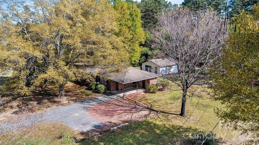 Completely refreshed and full of charm, this move-in ready brick ranch with a detached workshop offers the rare combination of style, space, and functionality — all set on nearly 2 acres with no HOA.  

Inside, you’ll find beautifully refinished hardwood floors, fresh paint throughout, and a light-filled layout that feels warm, clean, and inviting creating a home that is both comfortable and effortlessly livable from day one.

Step outside and the possibilities expand. The freshly painted exterior enhances curb appeal, while the detached workshop provides the flexibility today’s buyers are searching for — ideal for hobbies, storage, small business use, or additional workspace.

Whether you're looking for room to grow, space to create, or simply a peaceful setting to call home, this property delivers a lifestyle that is increasingly hard to find.

A rare blend of charm, land, and versatility — all within close proximity to Lake Norman, Denver, Lincolnton and Charlotte.