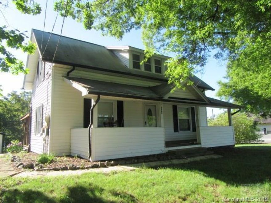 Charming two-story home, priced to sell! This beautiful home features an updated kitchen, large master bedroom with walk-in closet, and living room with wood-burning fireplace. Outside, enjoy two covered porches, a big beckoning backyard, tons of space for parking, and plenty of outdoor storage! Upstairs is a 300+ square ft room that could easily be used as a bedroom, office, or additional storage. (The ceiling height upstairs is 6' 10" and therefore does not meet the N.C. Real Estate Commission guideline of 7' to be considered heated square footage.) Laundry room on main level. Home has public water and sewer and is minutes from shopping and dining; all of the conveniences of living in the city, without the taxes!