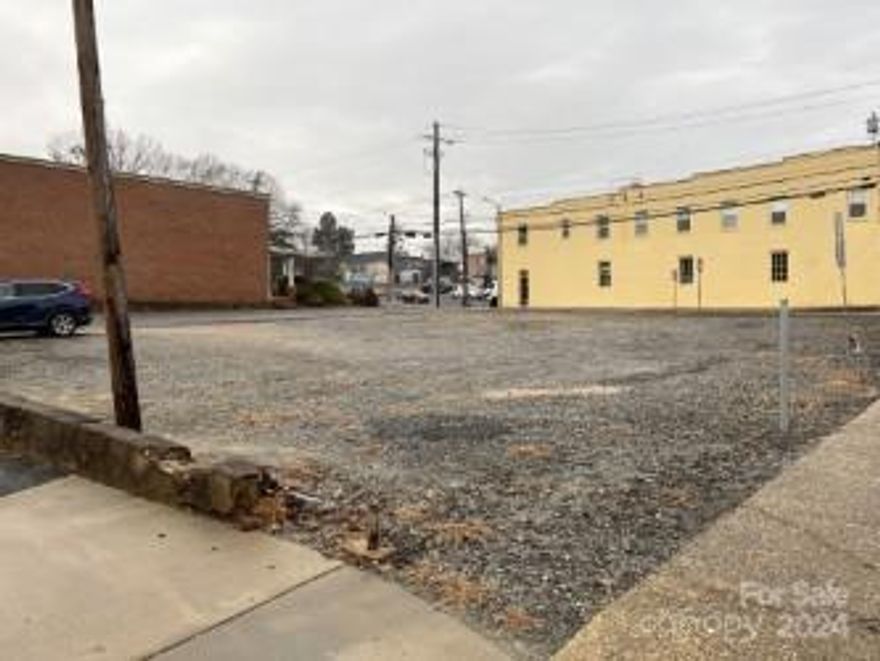 Property is vacant level lot in the middle of downtown Morganton.  This is a unique opportunity for commercial development opportunity in the center of downtown.  Owner financing is preferred method to finance acquisition.