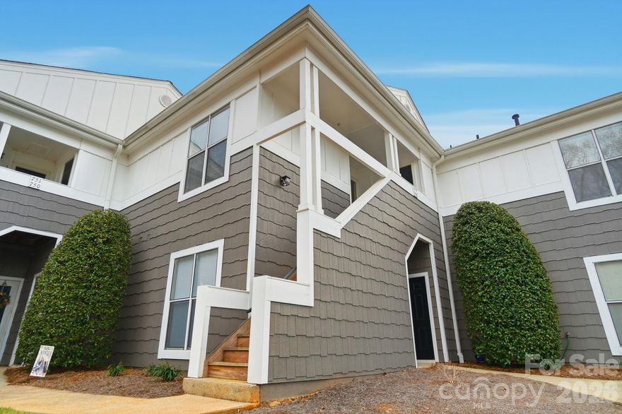 Welcome to this beautifully maintained second-floor condo offering comfort, charm, and an exceptional lifestyle. Featuring an open-concept layout and abundant natural light, this home provides the perfect blend of functionality and inviting living space.

The spacious living room showcases a cozy gas fireplace and ceiling fan, creating a warm and welcoming atmosphere year-round. Large windows and a sliding patio door lead to an oversized open-air balcony, seamlessly blending indoor and outdoor living. The balcony also includes its own ceiling fan, making it a comfortable retreat for morning coffee or relaxing evenings.

The kitchen is equipped with sleek stainless steel appliances, ample cabinetry, and a layout that flows effortlessly into the dining and living areas—ideal for entertaining.

Both bedrooms are generously sized and feature walk-in closets for excellent storage. The primary suite offers added privacy with a full en-suite bath and its own sliding patio door providing direct access to the balcony, creating a peaceful extension of the living space. The second full bathroom is conveniently located for guests or family.

Beyond the home itself, residents enjoy outstanding community amenities including tennis and pickleball courts, a community pool, and scenic lakeside walking trails. Perfectly positioned within walking distance to waterfront restaurants and charming downtown Davidson, this property offers a rare combination of low-maintenance living, recreation, and everyday convenience.

This is an opportunity to enjoy an active, walkable lifestyle in a sought-after setting.